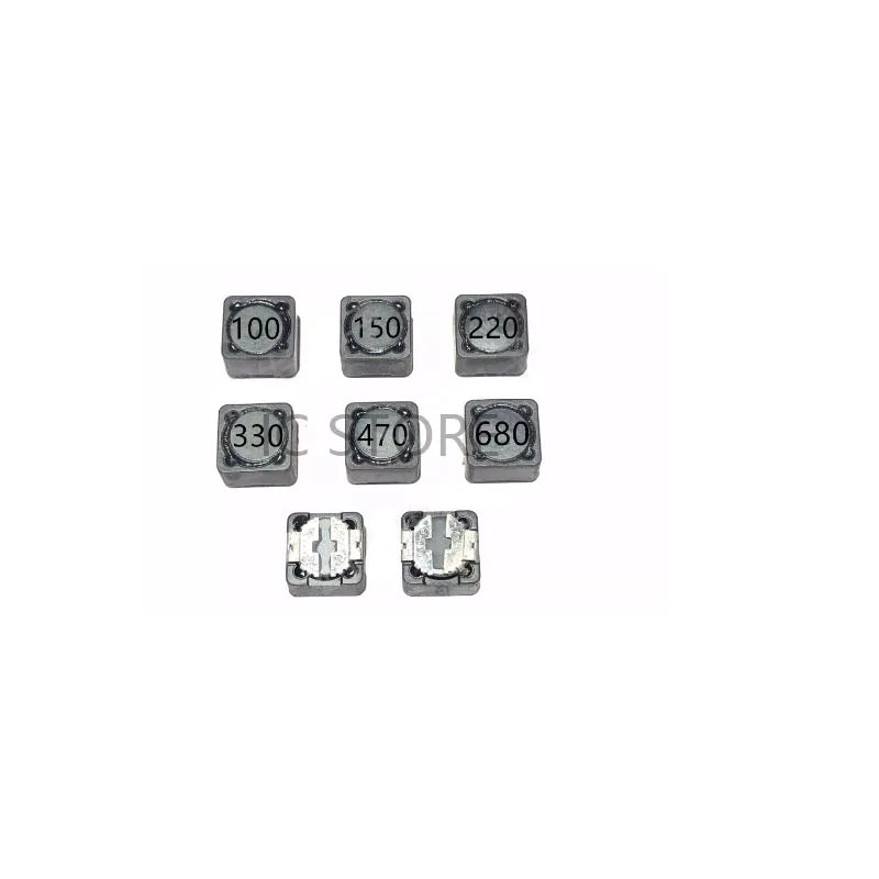 Set of small electronic components with labeled values on a white background